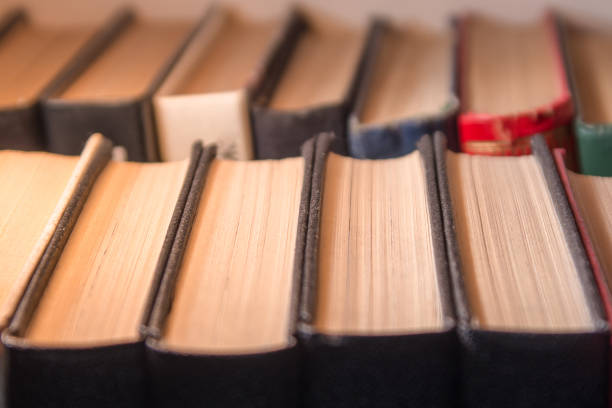 Rows of old books on the shelf, no labels