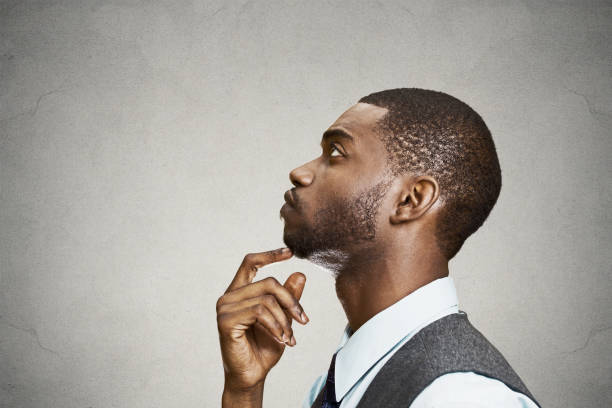 istock side view profile portrait, headshot young man daydreaming deeply about something 669669658
