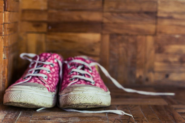 istock Canvas shoes on wooden background 669670188