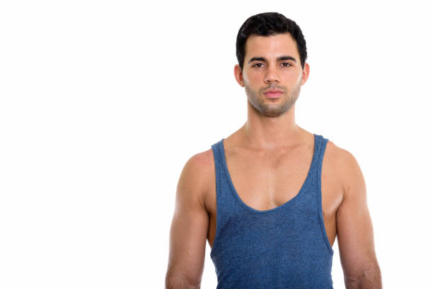Studio shot of young handsome Hispanic man horizontal shot