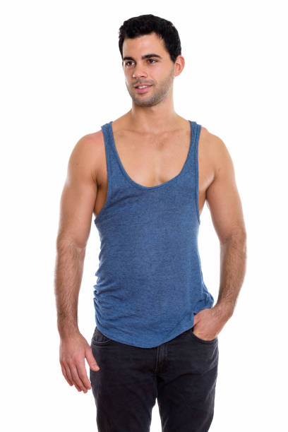 istock Studio shot of young happy handsome Hispanic man smiling while thinking 669670316