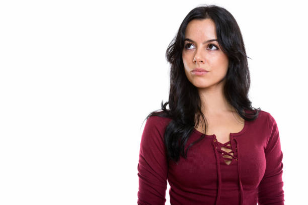 istock Studio shot of young beautiful Spanish woman thinking while looking up 669673644