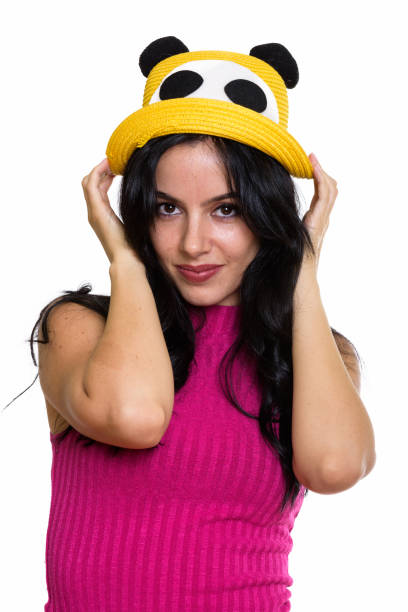 istock Studio shot of young beautiful Spanish woman holding hat with both hands 669681128