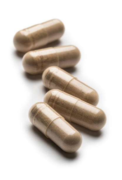 Herb capsules for Health on white background