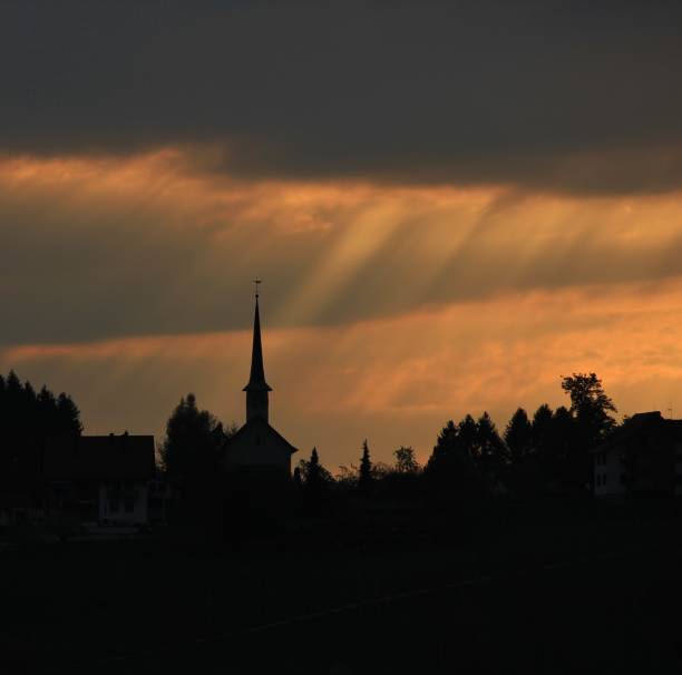 istock Sunbeams over a  church 669685058