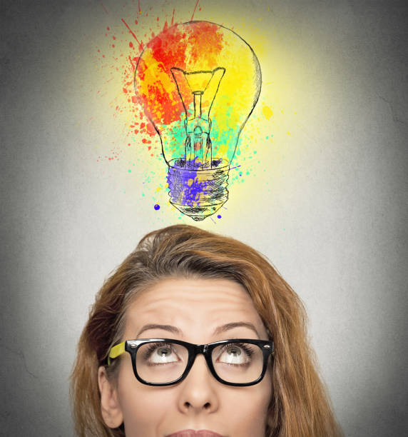 istock woman having brilliant idea colorful lightbulb above head, 669687716