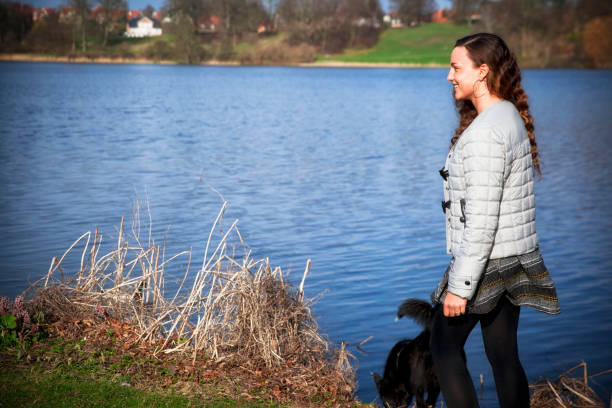istock Young woman walking her dog. 669688802