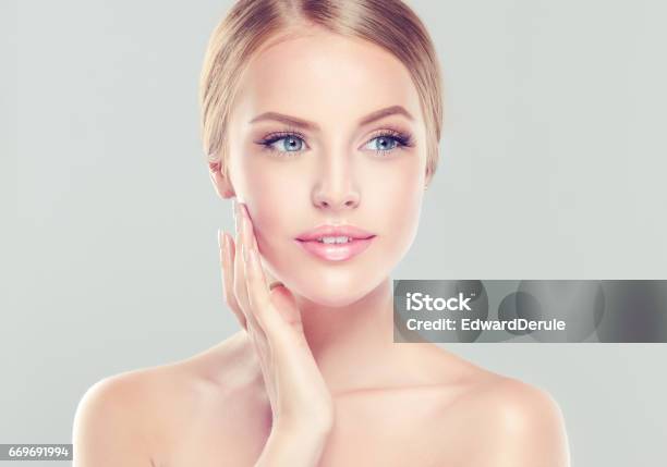 Portrait Of Young Woman With Clean Fresh Skin And Soft Delicate Make Up Stock Photo - Download Image Now