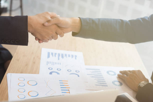 istock businessman handshaking after meeting in office - teamwork, cooperation, agreement, acquisition concept 669692202