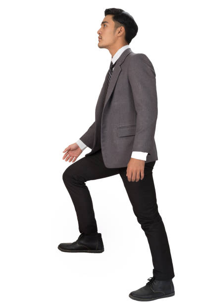 istock Ambitions concept with businessman climbing stairs 669692296