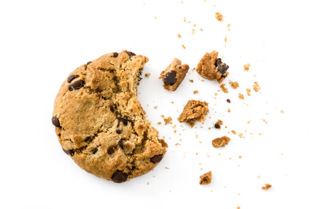 Chocolate chip cookie Chocolate chip cookie and crumbs isolated on white background crumb stock pictures, royalty-free photos & images