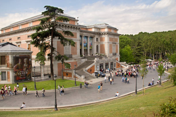 Prado Museum in Madrid, Spain Tourists queue at the entrance of the Prado Museum for the Hieronymus Bosch exhibition in Madrid, Spain on June 4, 2016 museo del prado stock pictures, royalty-free photos & images