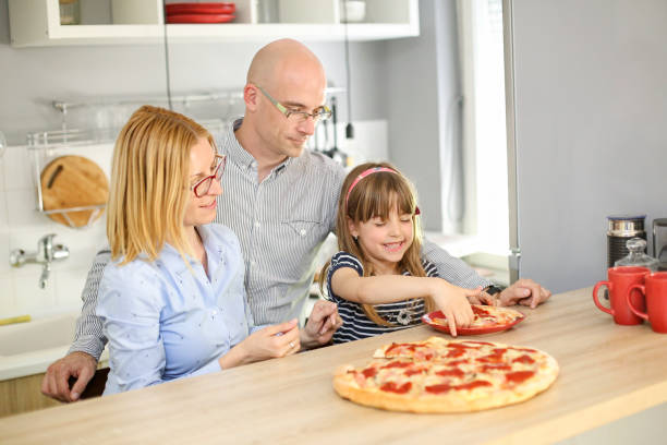 istock Family eating pizza 669698172