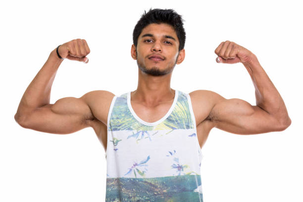 istock Studio shot of young handsome Indian man flexing both arms 669701830