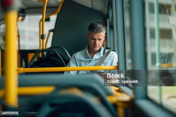 Businessman Traveling By Bus Stock Photo - Download Image Now - Bus, Public Transportation, Commuter