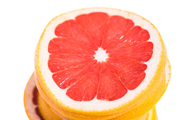 istock Texture of a ripe grapefruit slice, closeup 669705532