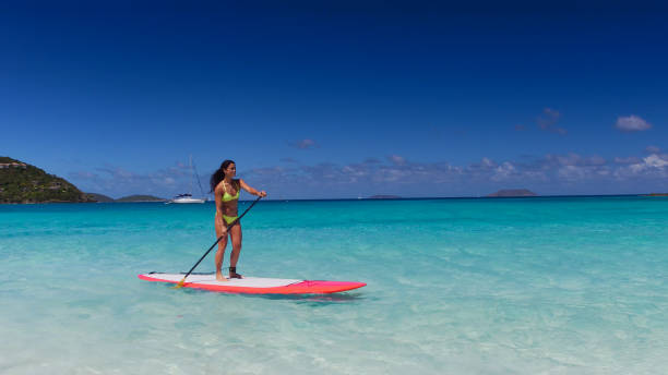 istock young attractive woman on paddleboard 669706078