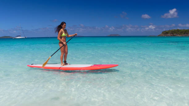 istock young attractive woman on paddleboard 669706080