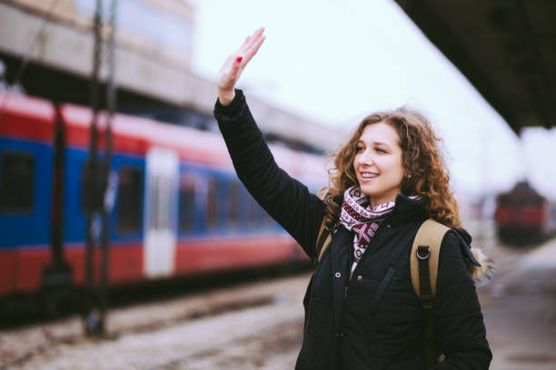 istock Girl Waving From Railroad Station Platform 669706260