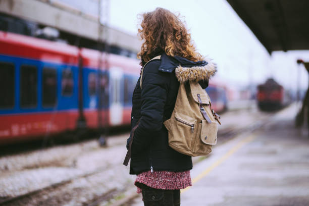 istock Curly-haired Girl Waiting For A Train 669708734