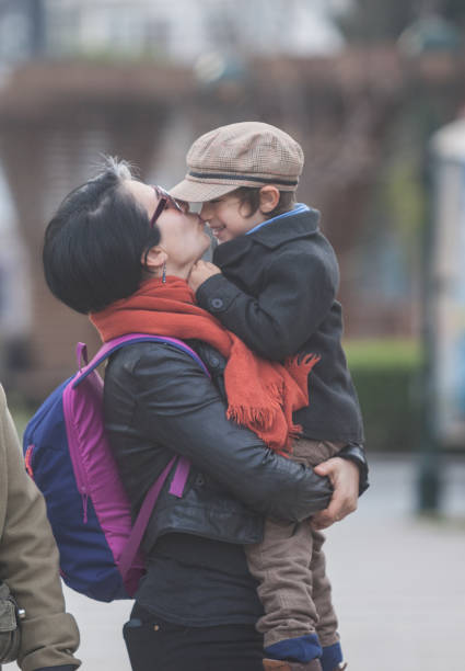 istock Millennial Parents With Son On The Street 669709278