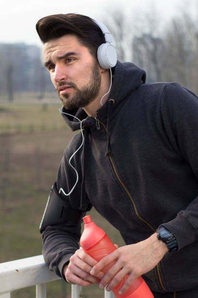 istock Guy with bottle of water 669712946