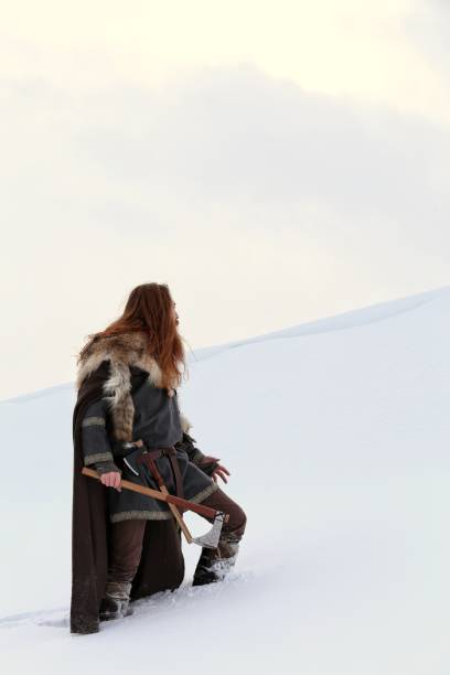 istock Medieval Winter Snow Viking Warrior, Authentic Costume, Animal Pelt, Ax 669716294