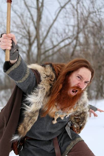istock Angry Attacking Medieval Winter Snow Viking Warrior, Animal Pelt, Ax 669719308
