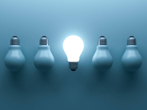 istock One glowing light bulb standing out from the unlit incandescent bulbs on cyan background with reflection and shadow , individuality and different creative idea concepts . 3D rendering 669719676