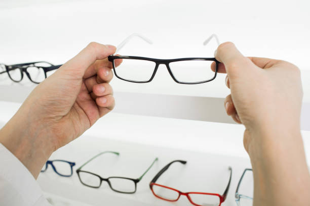 istock Choose glasses in the store optics 669720110