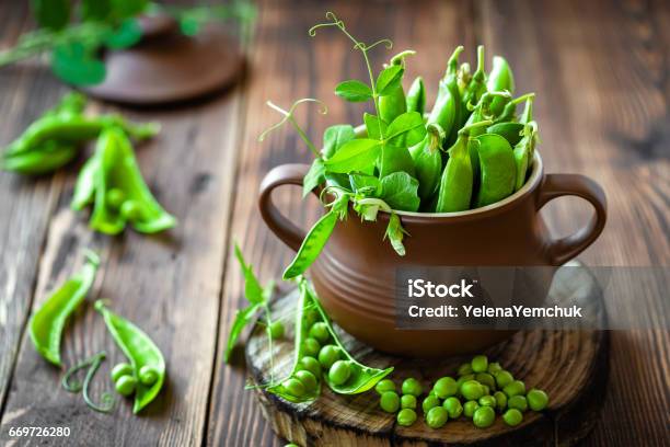 Fresh Green Peas On Dark Wooden Rustic Background Stock Photo - Download Image Now - Backgrounds, Bean, Close-up