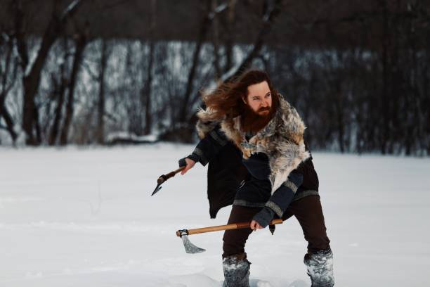 istock Medieval Winter Snow Viking Warrior, Authentic Costume, Animal Pelt, Ax 669729104