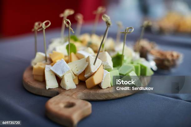 Cheese Platter Assorted With Nuts And Honey Stock Photo - Download Image Now - Appetizer, Outdoors, Plank - Timber