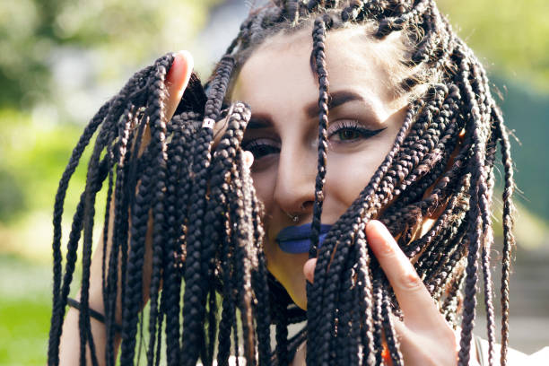 istock Alternative young girl with african braids. 669736002