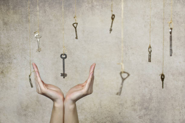 istock hand stretching for one of the many old vintage keys 669737708