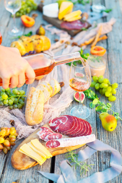 istock Picnic with rose wine fruits meat and cheese 669740948