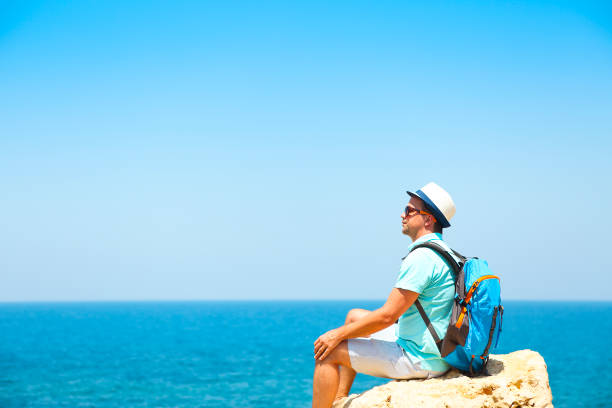 istock Man on rock above the sea 669741292