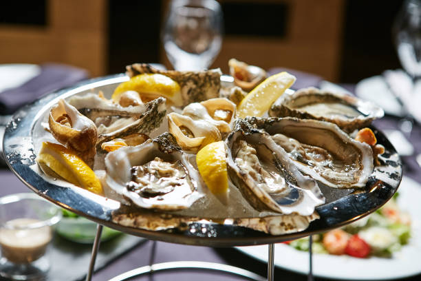 istock platter of fresh organic raw oysters on ice 669743594