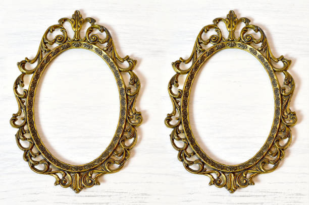 istock Two empty vintage picture frames on white grunge background 669761592