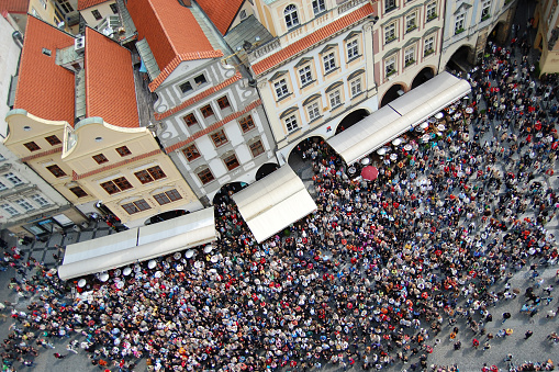 Crowded Prague´s Old Town square from above. Tourists waiting for Astronomical Clock´s show.