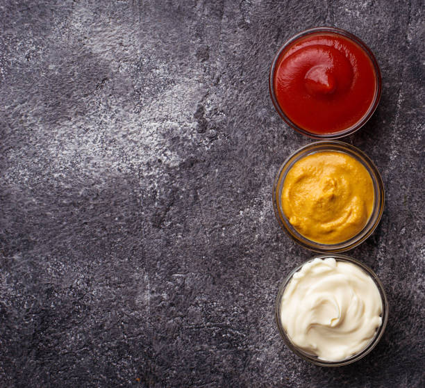 istock Set of different sauces: mustard, ketchup, mayonnaise. 669772410