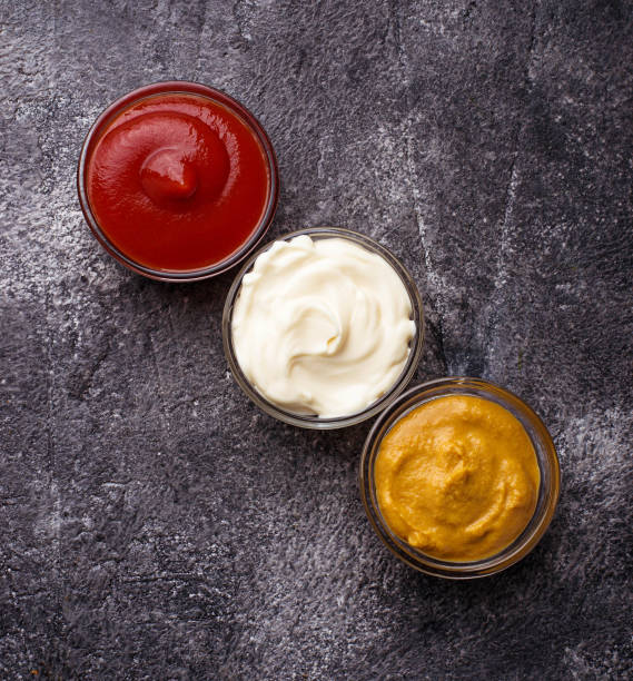 istock Set of different sauces: mustard, ketchup, mayonnaise. 669772424