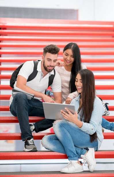 istock Group of students at the university looking at a tablet computer 669775638