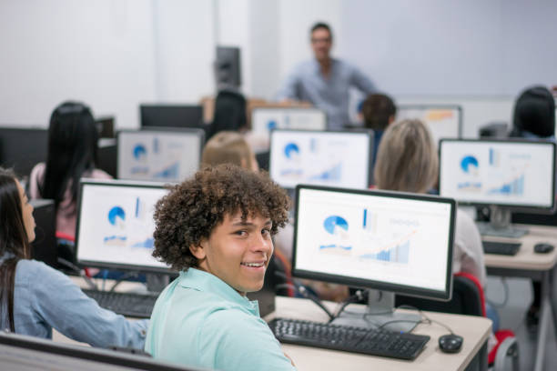 istock Happy male student in an IT class at school 669775752