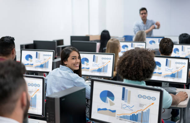 istock Female student in an IT class at the school looking at the camera 669775766