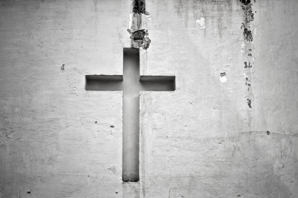 Cross figure religion on a white wall of church