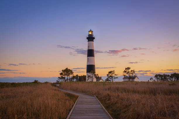 istock Sunset at Bodie Island Lighthouse from the marsh 669776406