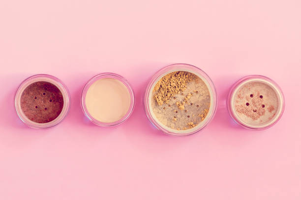 istock Mineral beauty makeup kit on pink 669780336