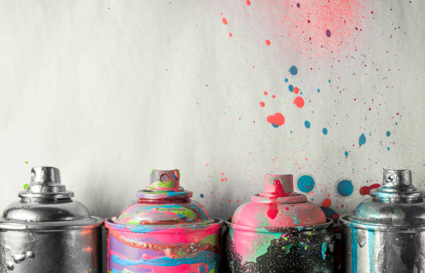 istock aerosol paints on a dirty gray background. 669789254