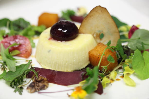 istock Goat cheese herbs flan, fall salad, beets, roasted beets, butternut squash, greens, pear, walnuts. 669797698